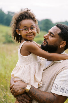 cute moment of black father and daughter bonding together 