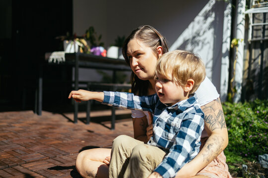 Mother and son talking in the backyard