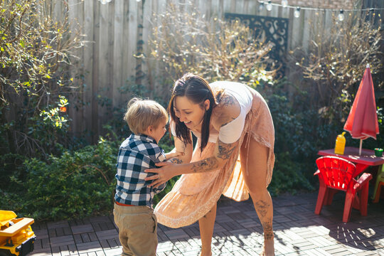 Mother and son having fun in the backyard