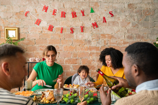 Family celebrating Christmas at home