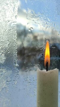 Frozen glass melts from burning candle №5 ( slow motion )