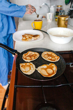  pancake cooking on cooker in kitchen