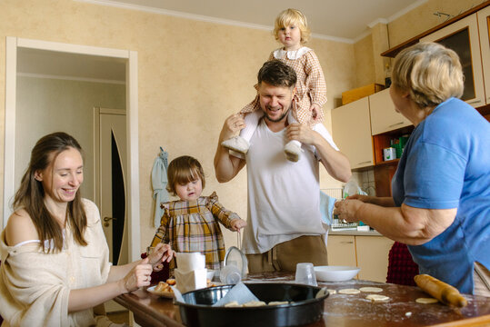family cooking together in the kitchen