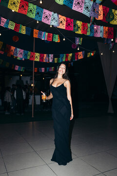 Happy Woman in Black Dress during a Party