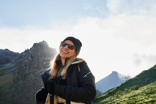 Blonde young woman trekking