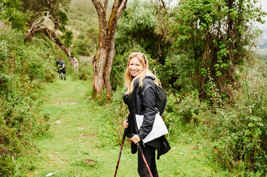 Blonde young woman trekking
