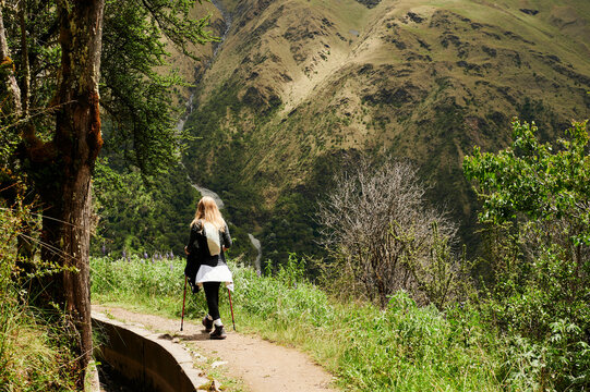 Blonde young woman trekking