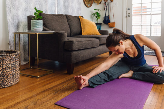  Relaxing Seated Yoga Stretch in Cozy Home Setting