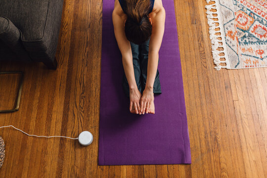 Deep Forward Fold Stretch for Flexibility on a Yoga Mat