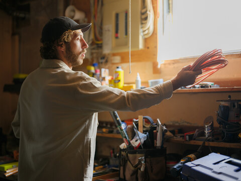 Man working in a tool shed 