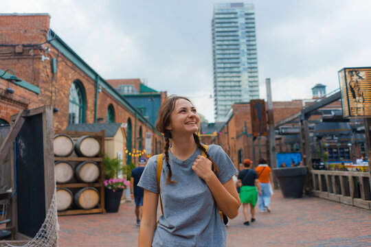 Woman walking in Distillery district in Toronto, Canada 