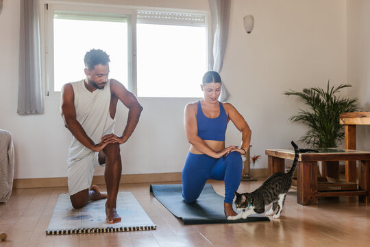 A couple doing sports at home