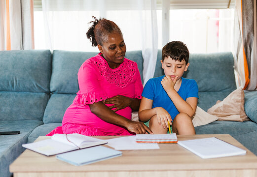 A pregnant woman teaching several subjects at home