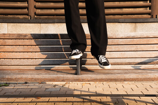 Balancing on a Bench Armrest in Style