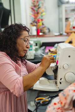 Seamstress working on a sewing machine

