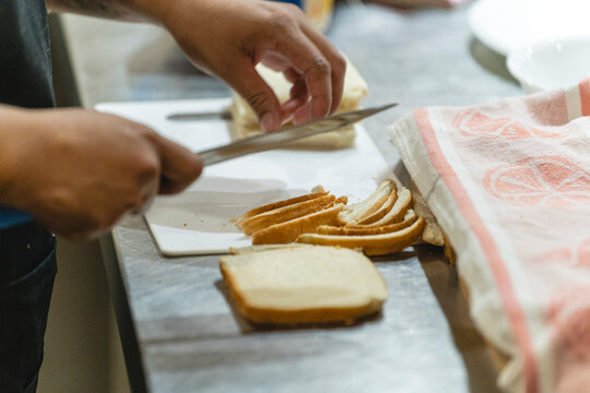 Slicing bread in the kitchen