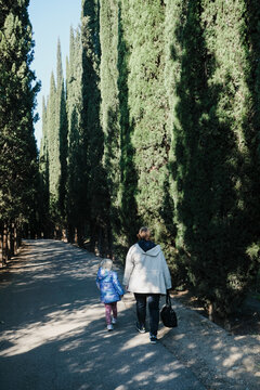 A kid walking in the botanic garden of Tbilisi