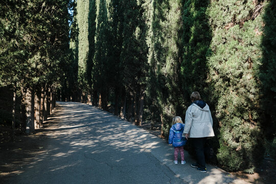 A kid walking in the botanic garden of Tbilisi
