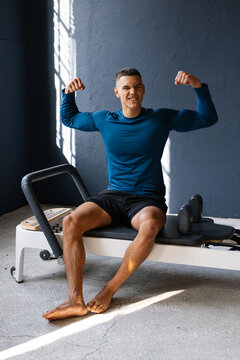 Cute Male Athlete Showing Off Muscles