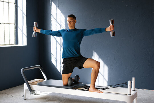 Young Athletic Man Doing Pilates