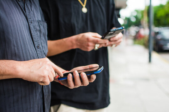 Father and son with smartphones