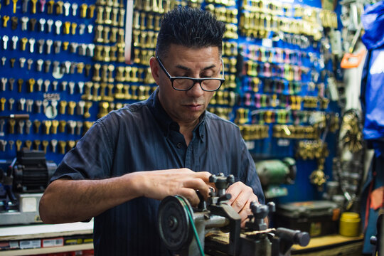 Locksmith working with old tools and equipment