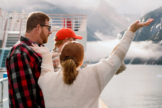  Passengers Enjoying Scenic Views from Cruise Ship
