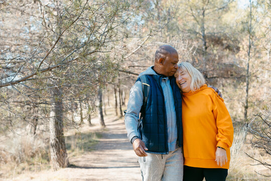 Cheerful affectionate Senior couple walking in nature