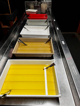 Colorful Trays With Various Liquid Ingredients in a Kitchen Setup