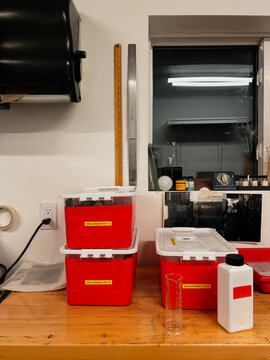 Workstation Setup With Red Storage Boxes and Tools in a Bright Room