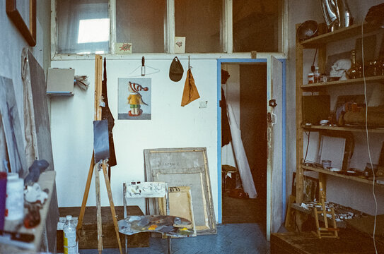 Cozy Artist's Studio with Easel and Art Supplies