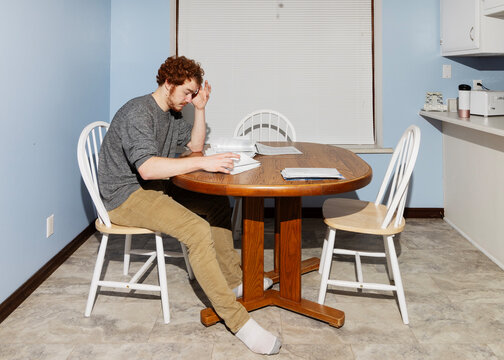 Stressed College Student Sorting Paperwork