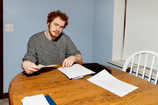 College Student Sorting Through Paperwork