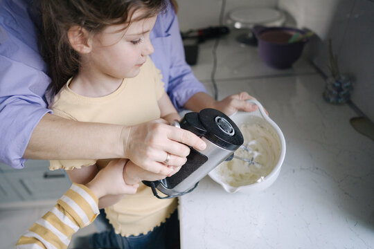 Little girl cooking in the kitchen