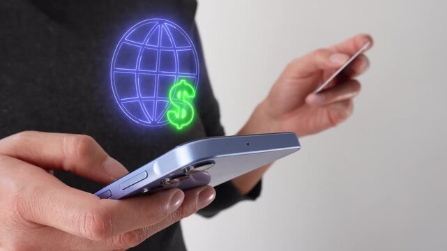 Income earned online. Businesswoman holding a bank card while holding a smartphone with a virtual globe icon and a dollar sign.