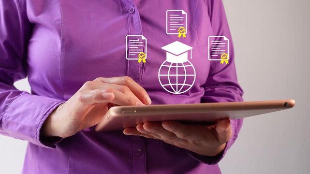 Close-up of a businesswoman interacting with her tablet, which features an animated globe with a graduation cap and several certificates. Online education.