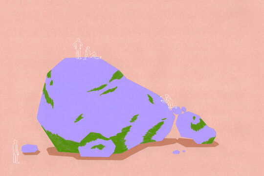 Group of people climbing a rock
