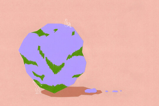 Person balancing a big rock