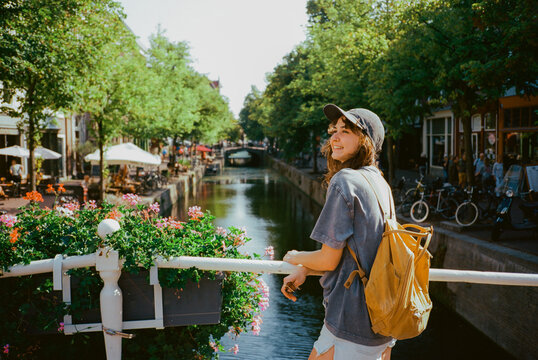 Woman walking in Dutch town in summer 