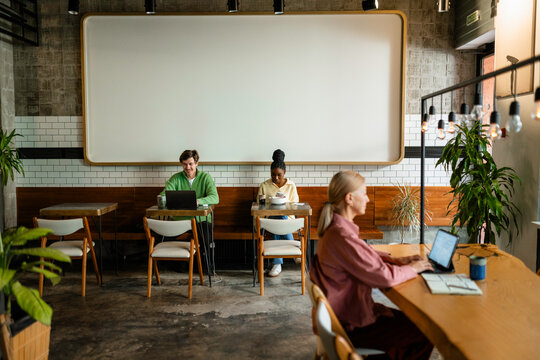 A group of people work in a coworking space