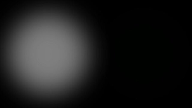 Abstract composition with a dark background featuring a soft grey gradient on the left and a bright, glowing neon green circle on the right side of the frame