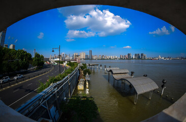 Obraz premium Manhattan Skyline View from Circular Window, Hudson River Waterfront