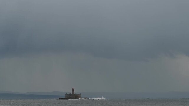 Bugio lighthouse surrounded by waves in Tagus river