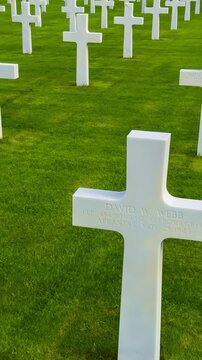 Rows of white crosses at the American World War II cemetery on the Normandy coast, Colleville-sur-Mer, Manche department, France, October 16, 2025. High quality 4k footage
