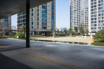 Modern residential complex plaza with water feature and high-rise buildings © zhu difeng