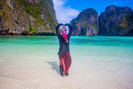 young woman on the tropical beach maya bay krabi thailand,	