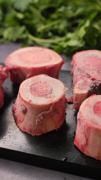 Cooking with beef bones and fresh herbs for broth