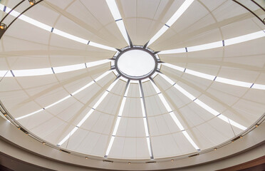 Naklejka premium Modern architectural dome with radial light panels and central skyligh
