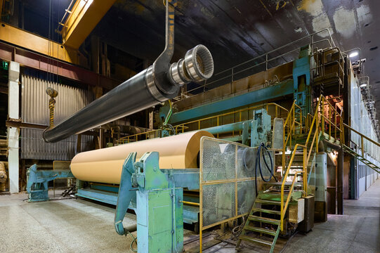 Paper machine operating in a large paper mill during daytime hours