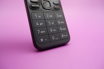 Obraz premium Feature Phone Keypad Detail Isolated on Purple Surface